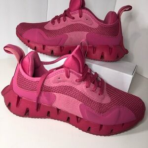 Pink Reebok running shoes. 8.5 Women - Brand New, not in original shoe box.